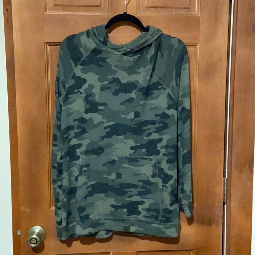Woman’s camouflage sweatshirt with hoodie.